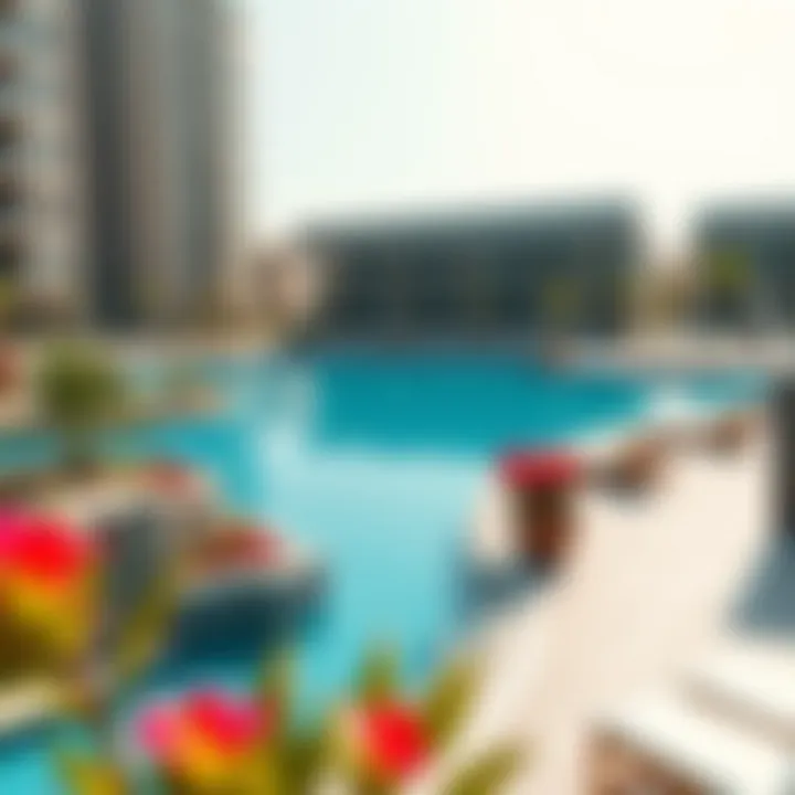 Luxurious swimming pool area at Dorra Bay Tower Marina with vibrant landscaping and lounge spaces