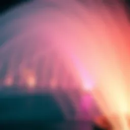 A close-up view of the Dubai Fountain's water jets in action, illuminated with colorful lights at night